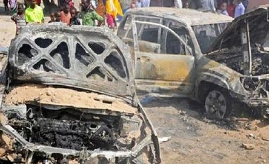 Death toll in Somalia twin car bombings rises to at least 20, says doctor Somalia blast