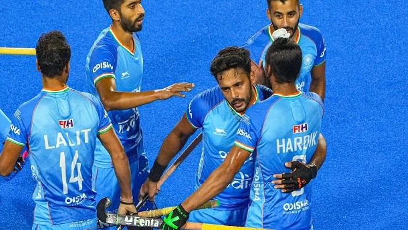 Indian Hockey Team Hardik Singh (8) of India with teammates celebrates after scoring a goal against Spain during a matc