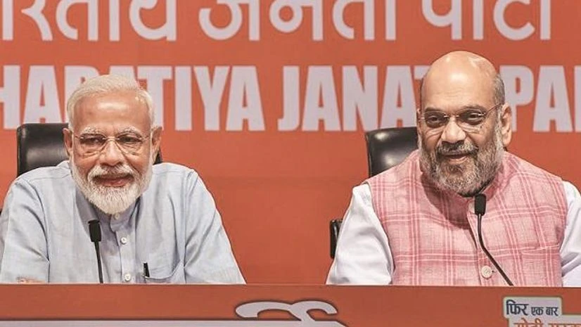 Narendra Modi Prime Minister Narendra Modi (left) with Union Home Minister Amit Shah (right).