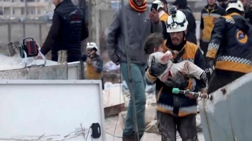 turkey A rescuer carries an injured child away from the rubble of a building following an earthquake in rebel-held Azaz, Syria February 6, 2023 in this still image taken from video. REUTERS/via Reuters TV